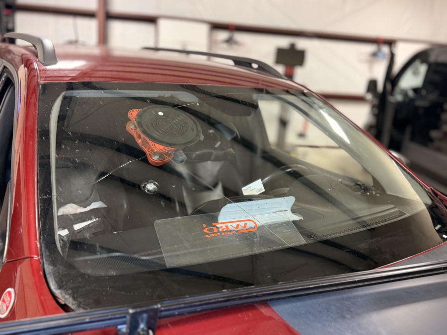 Windshield chip beside the forward ADAS camera on an SUV at South Texas Auto Glass in Corpus Christi